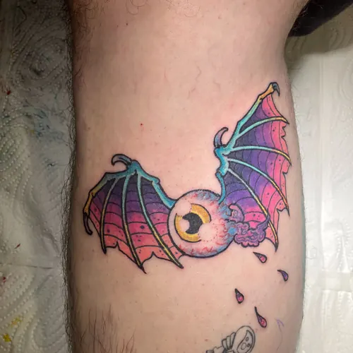 Flying eyeball with bat wings - upper arm · Jamie