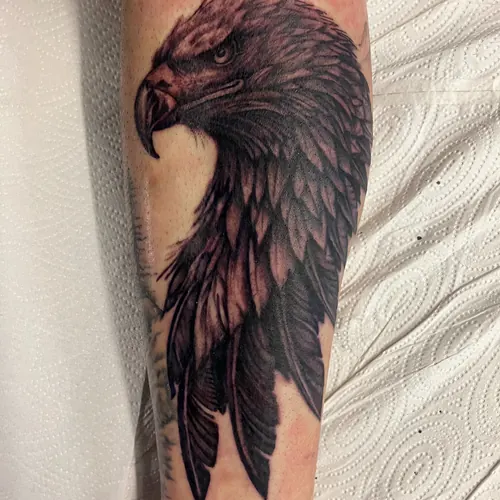 Black-and-grey eagle - upper arm · Jamie