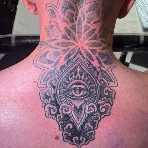 Ornamental mandala with an all-seeing eye - upper back · Jamie